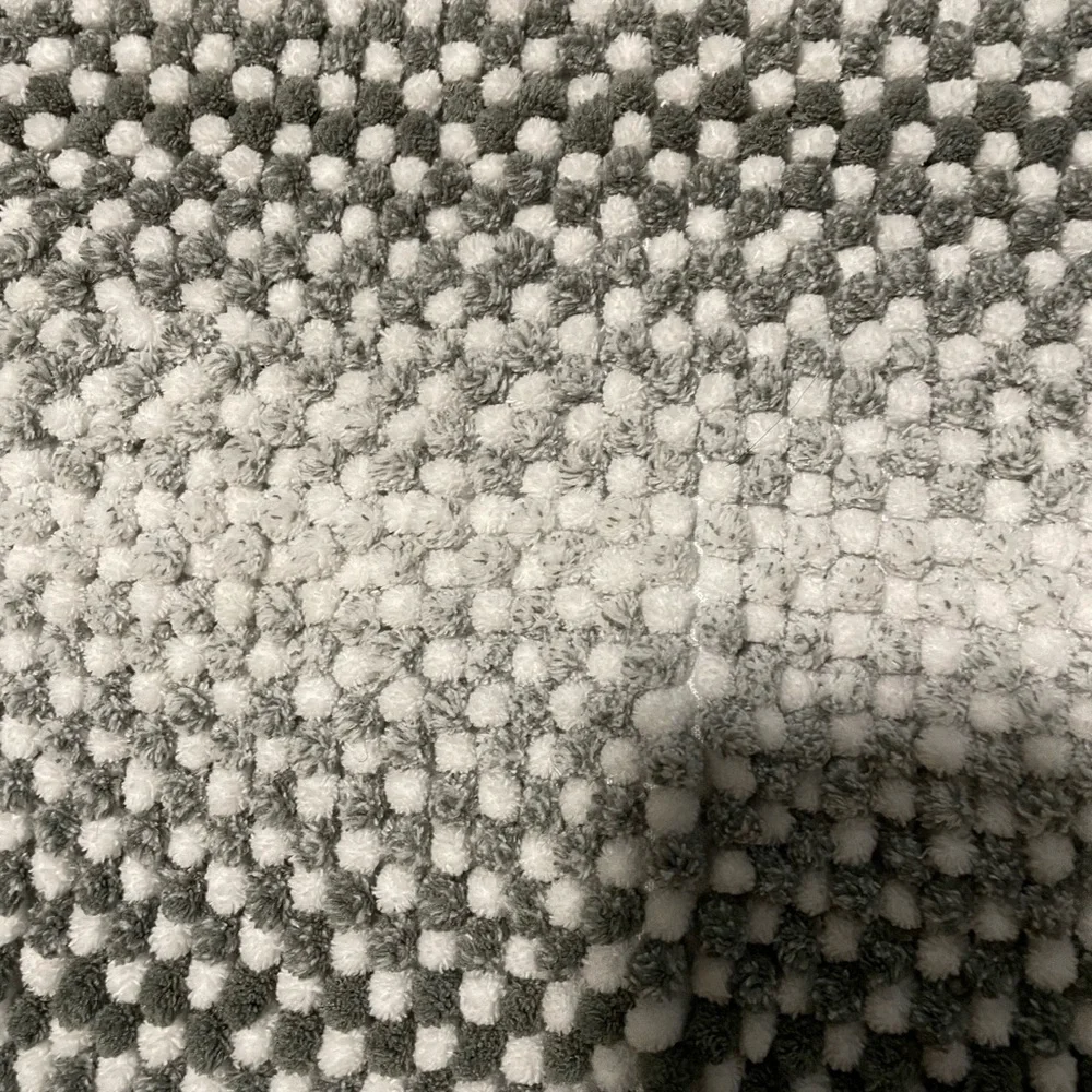 Grey and white bath mats